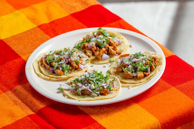 Spicy chicken tacos and wine.
